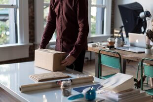 Person taping up package