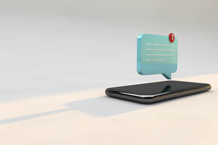 Phone with 3D illustration of push notification